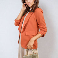 Orange open-front blazer with ruched sleeves and front pocket detail, 3/4 sleeves