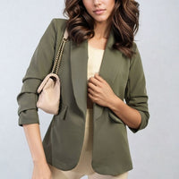 Open-front ruched-sleeve blazer jacket in olive green with front pockets and gathered cuffs.