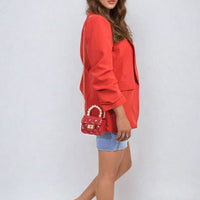 Red ruched-sleeve open-front blazer with long sleeves, side profile