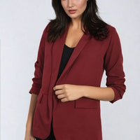 Open-front ruched-sleeve blazer jacket in burgundy with front pockets and notch lapels.