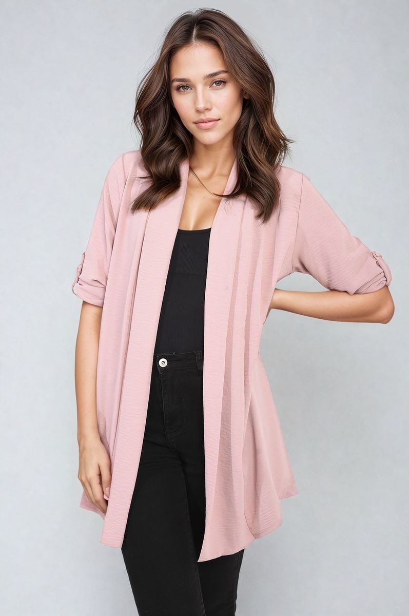 Blush pink open-front cardigan with short sleeves and draped front over black outfit