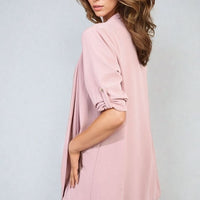 Pink open-front cardigan with roll-up sleeves, tunic-length drape