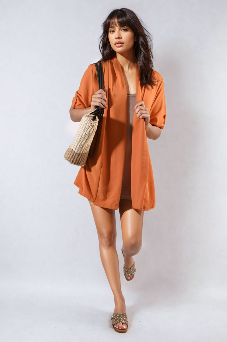 Orange open-front cardigan with rolled sleeves and button cuff detail