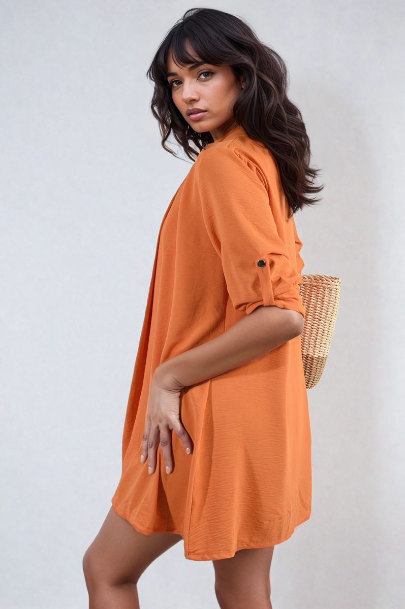 Orange open-front cardigan with rolled sleeves and button cuff detail