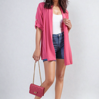 Open-front pink cardigan with rolled sleeves and relaxed, draped shape