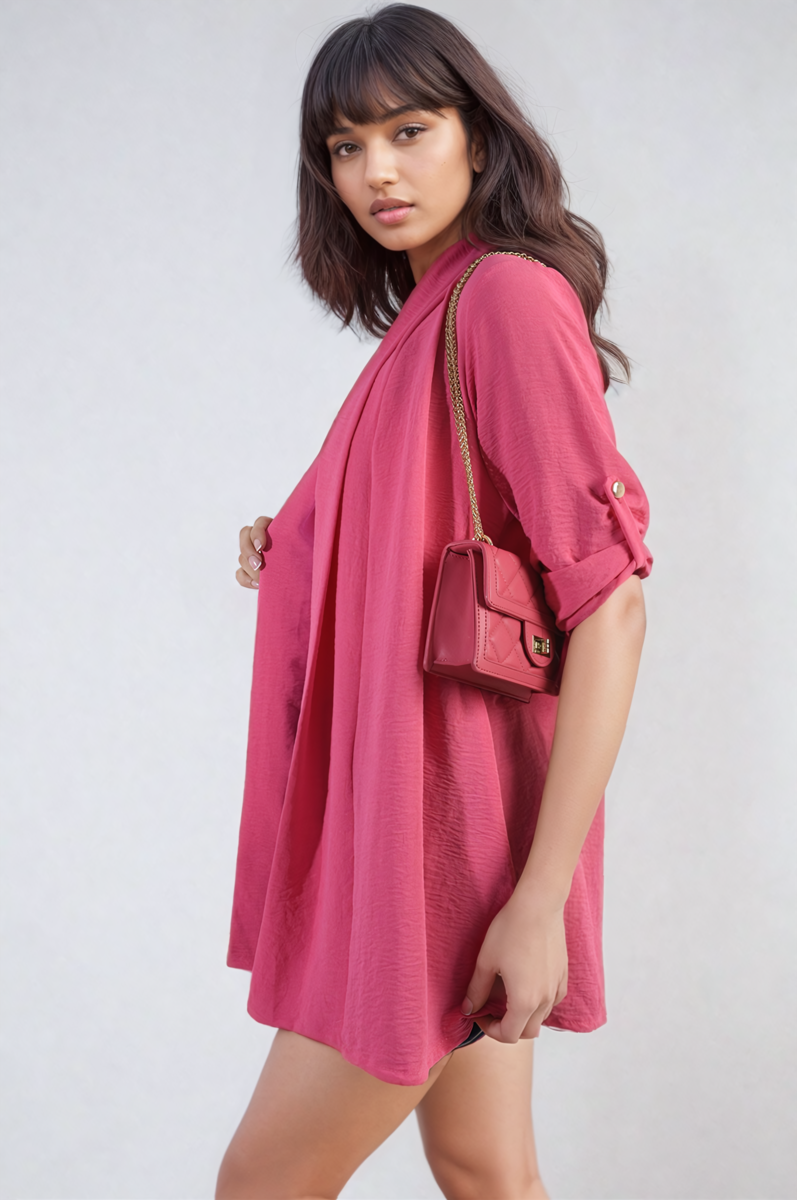 Fuchsia pink open-front cardigan with rolled sleeves and loose draped front