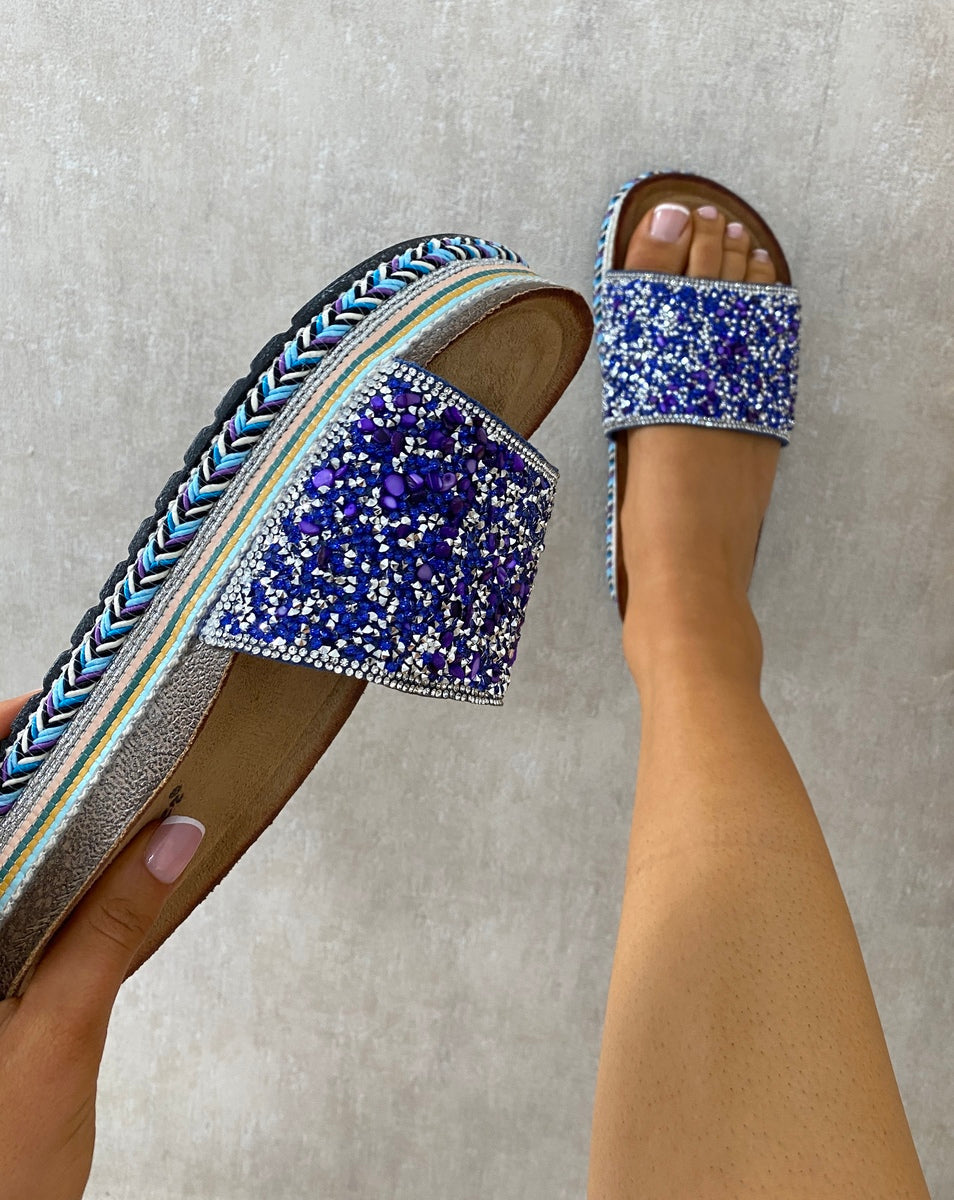Blue glitter platform slide sandals with braided trim and jeweled strap detail
