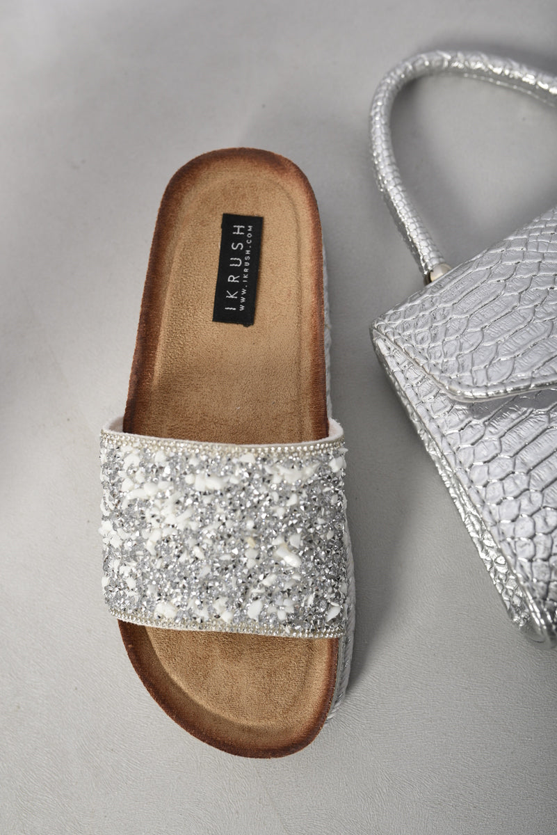 Silver stone-embellished slide sandals with cushioned footbed and braided edge sole