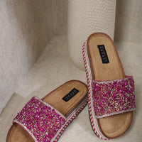 Fuchsia stone-embellished platform slide sandals with braided edge trim, tan footbed