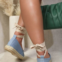 Espadrilles with ankle ties and woven toe cap, worn with denim and beige socks