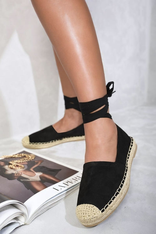 Black espadrilles with ankle ties and woven jute toe caps, side view