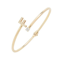 Gold initial F bangle with crystal cross charm and round stone accents