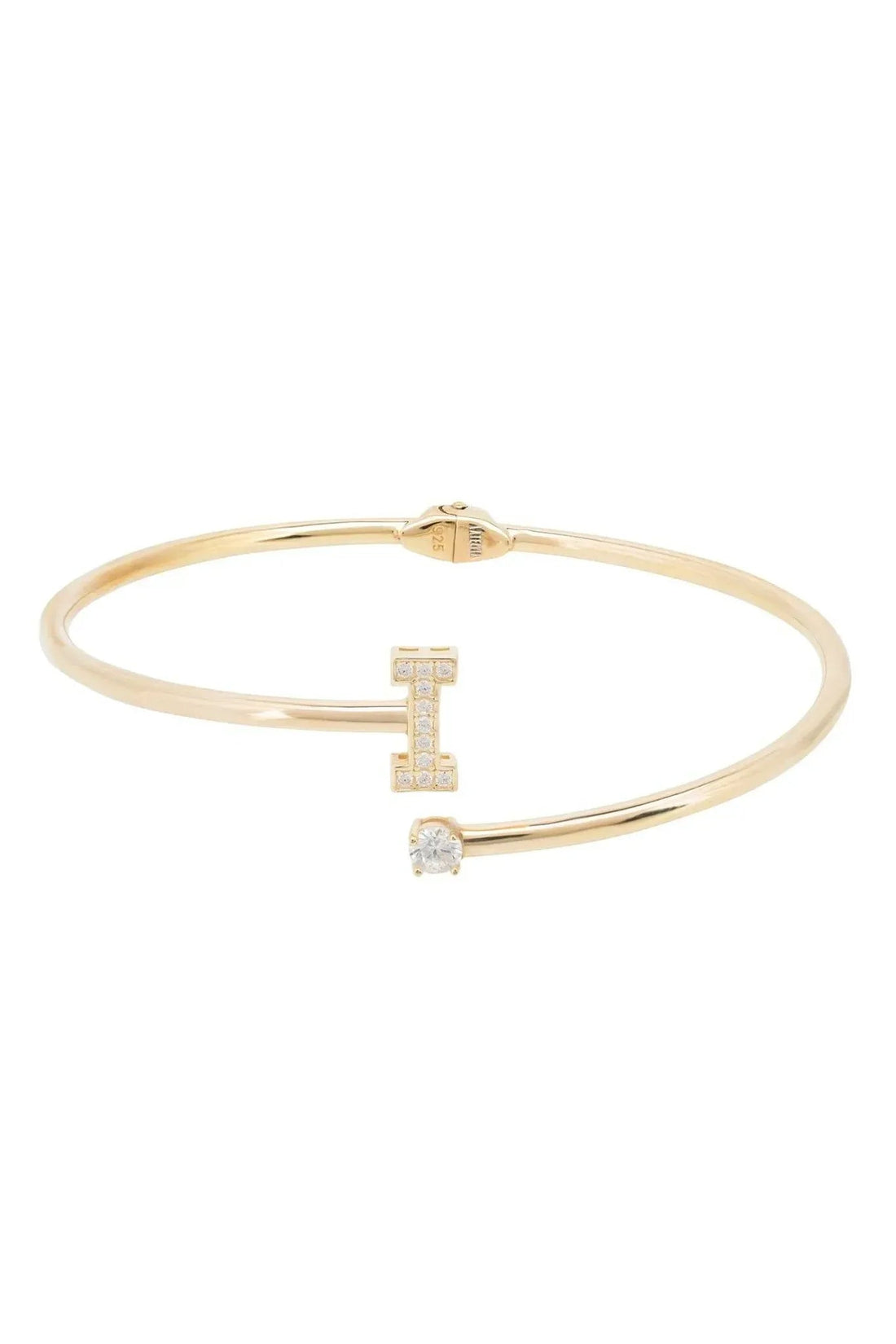 Gold tone initial bangle with square and round clear stones forming letter I