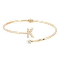 Gold initial bangle bracelet with a K charm and small crystal accent
