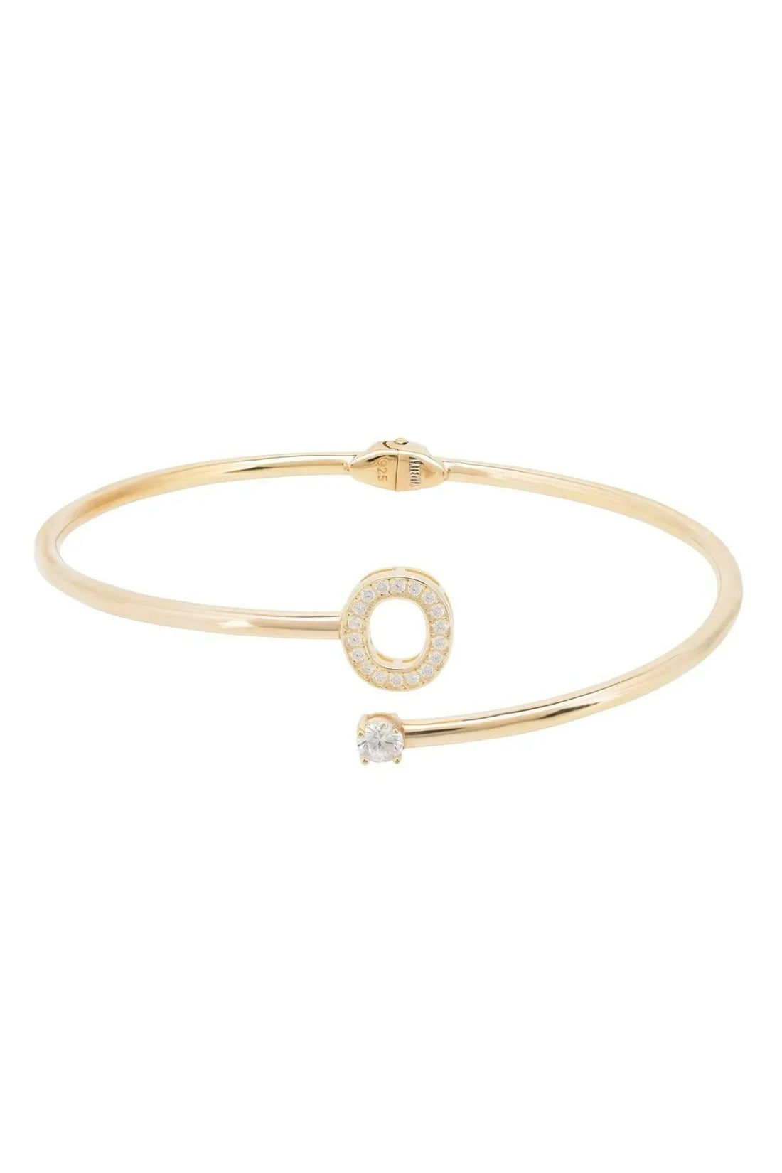 Gold-tone bangle featuring O initial ring charm and small central stone