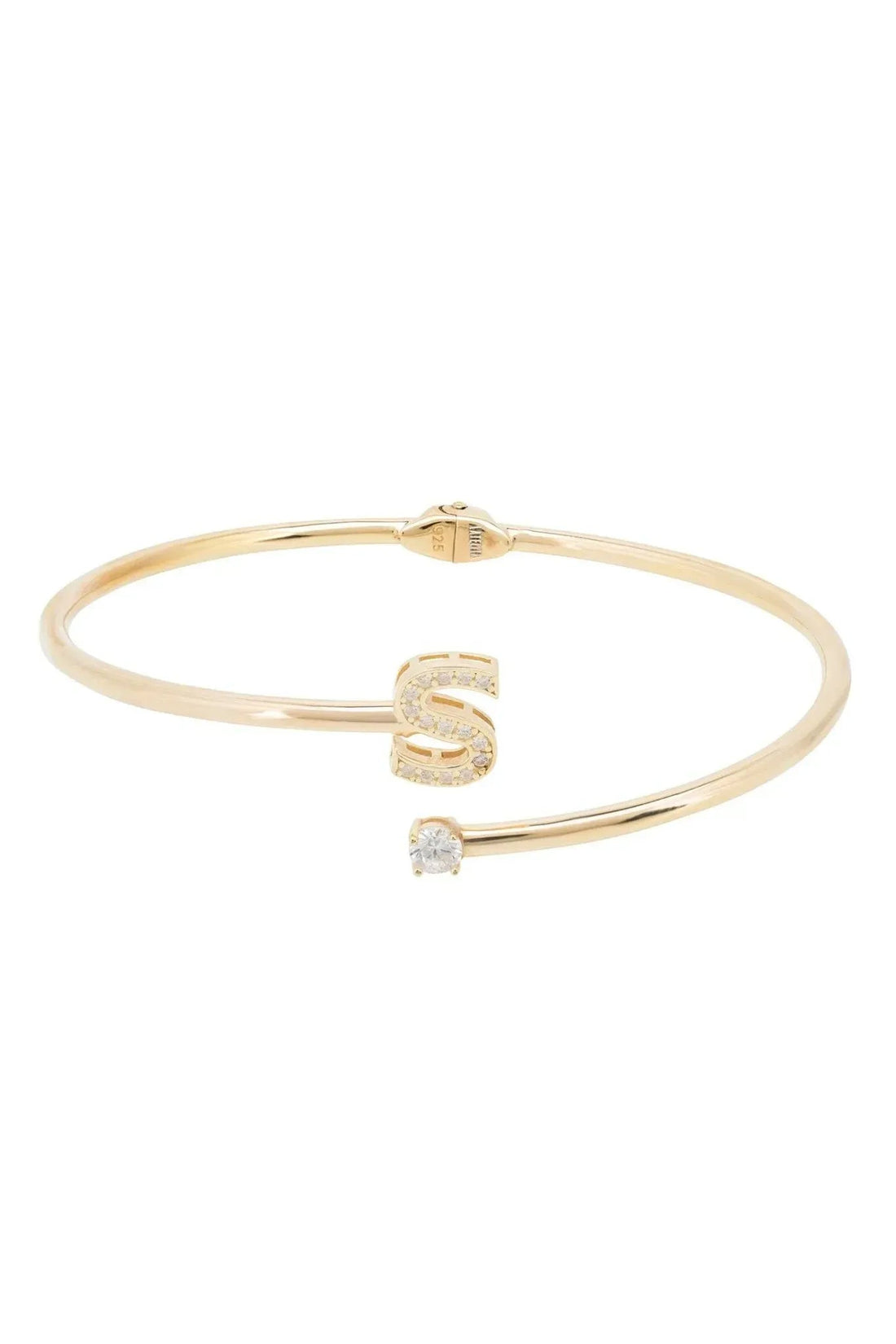 Gold-tone bangle featuring an initial S charm with crystal detail
