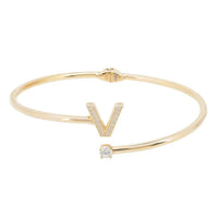 Gold-tone V initial bangle with small square crystal centerpiece