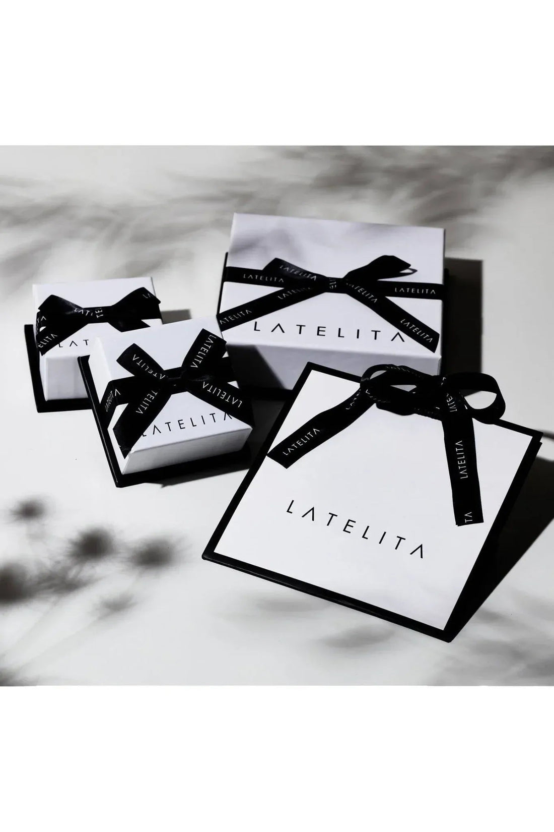 Gift boxes with black ribbon bows