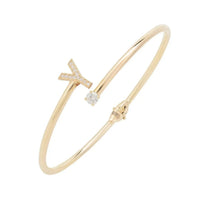 Gold-tone bangle bracelet with letter Y charm and small crystal accents
