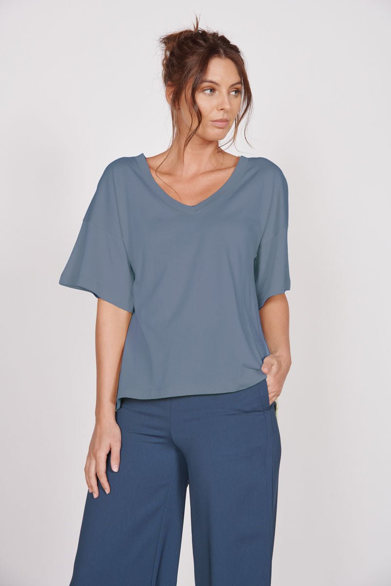 Oversized blue v-neck t-shirt, loose short sleeves and relaxed neckline