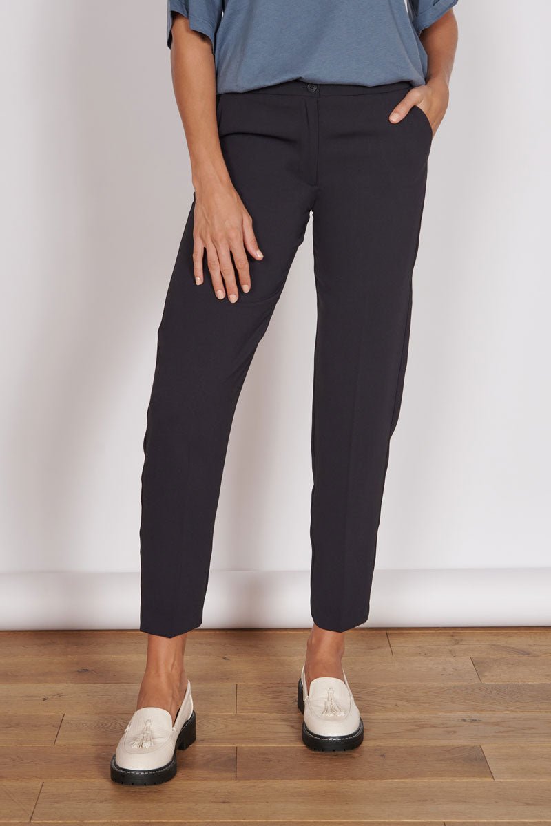 Black high-waist tapered pants, full front view, ankle length