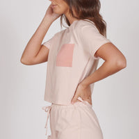 Light pink short pyjama set with square contrast pocket and side-tie drawstring shorts