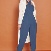 Navy tailored sleeveless jumpsuit with high cross halter neck and tapered ankle legs