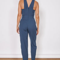 Navy tailored sleeveless jumpsuit with cross-back straps and tapered ankle legs