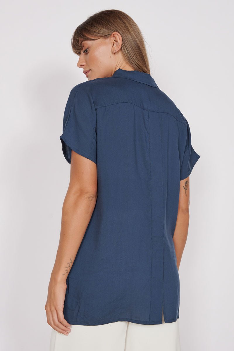Navy relaxed-fit utility shirt with short sleeves; back view