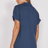 Navy relaxed-fit utility shirt with short sleeves; back view