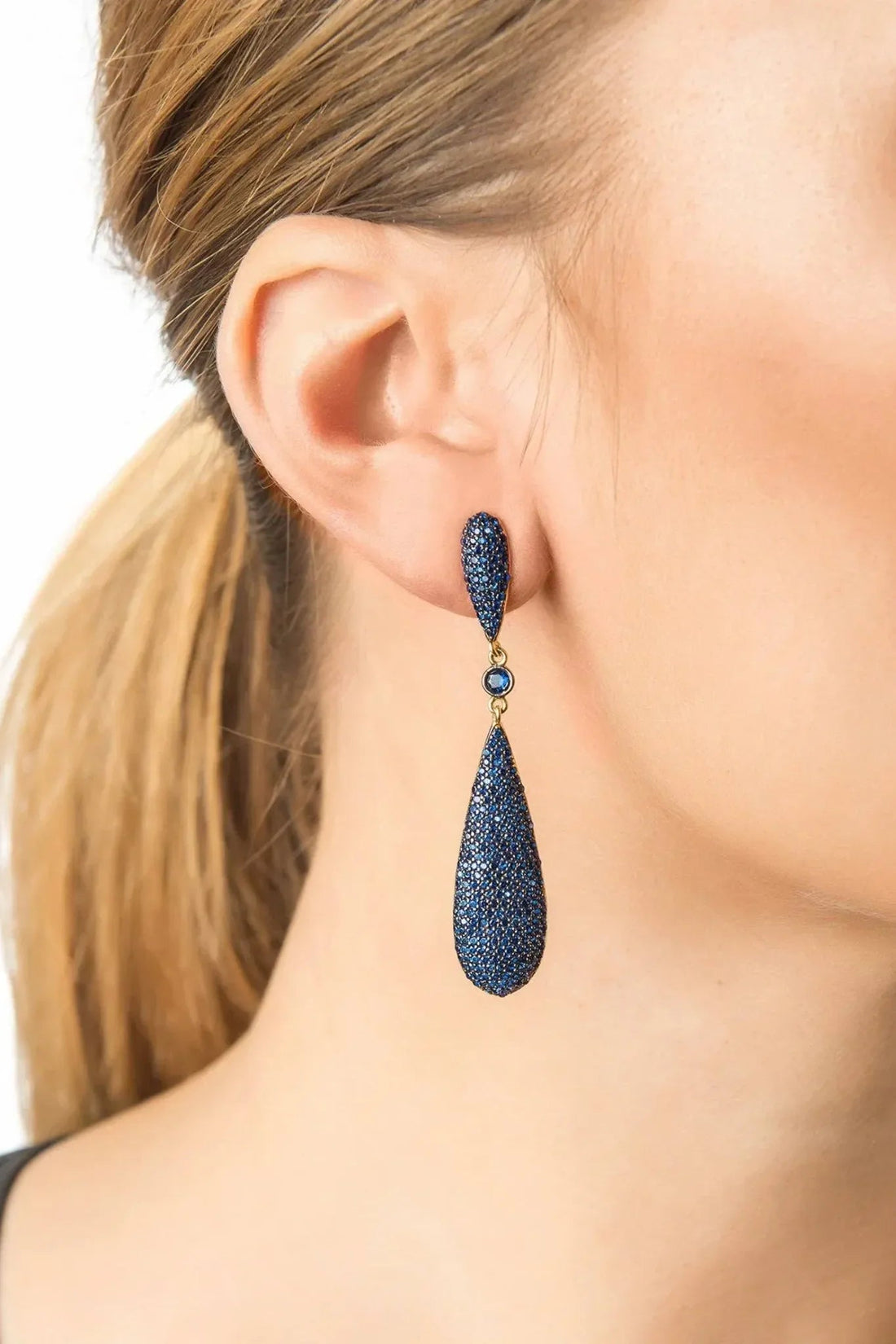Latelita sapphire blue CZ long drop earrings worn on ear