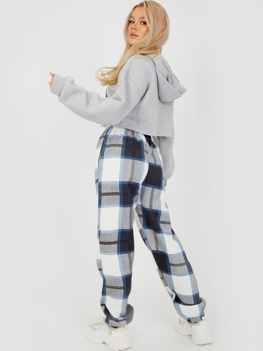 Checked jogger pants in navy, light blue, and white with elastic ankle cuffs