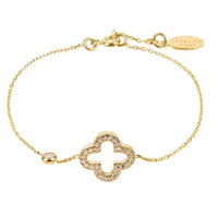 Gold clover bracelet with open four-leaf motif and pavé-style stones