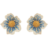 Gold-tone flower stud earrings with blue crystal-like petals