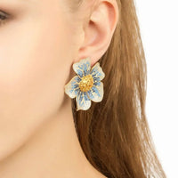 Blue and gold flower drop earrings on gold-tone hooks