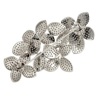 Silver flower petal brooch with rhinestone-style details and pin clasp
