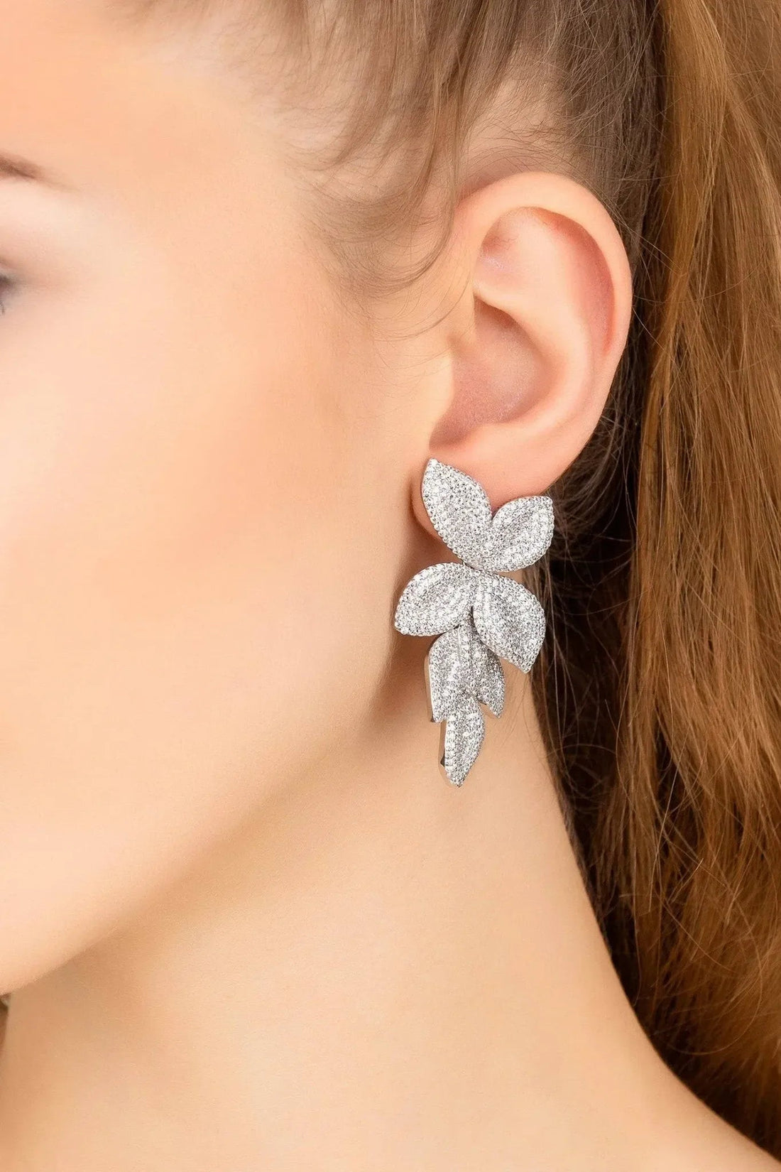 Silver floral drop earrings with three layered petal shapes