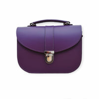 Purple leather crossbody bag with curved flap and front metal clasp