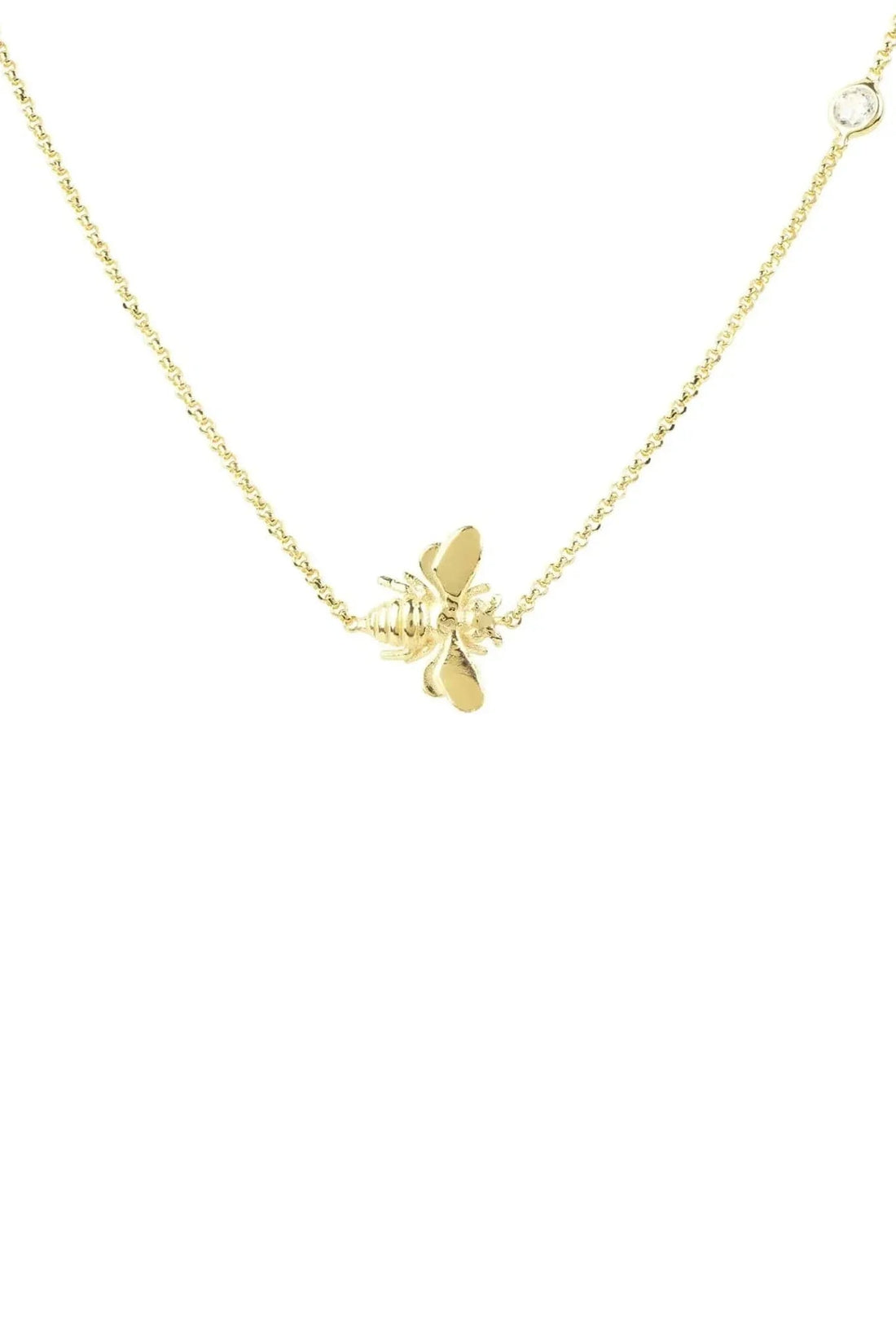 Gold-tone chain necklace with small winged bee charm at center