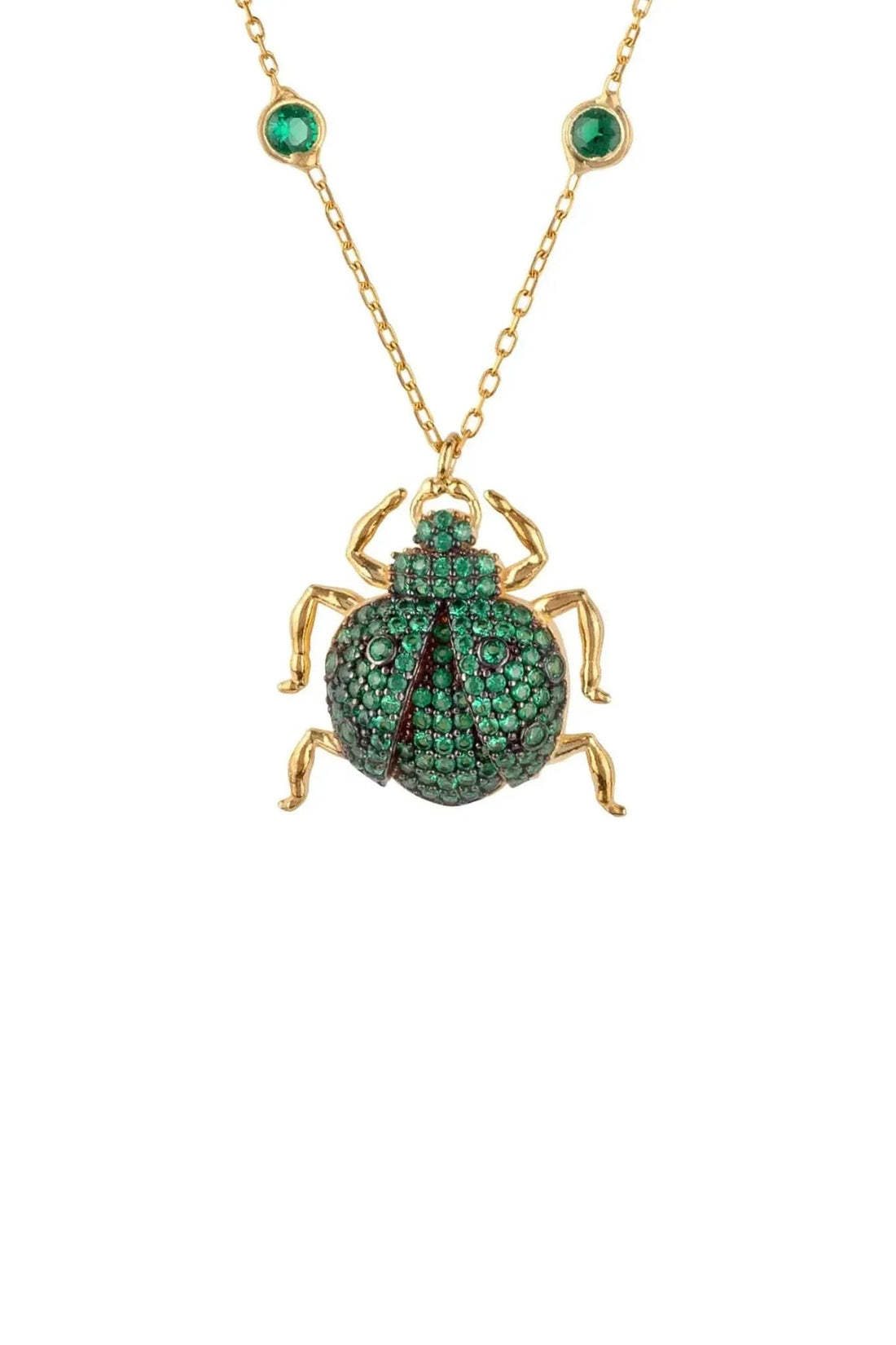 Gold-tone scarab pendant necklace with green gem detailing and chain