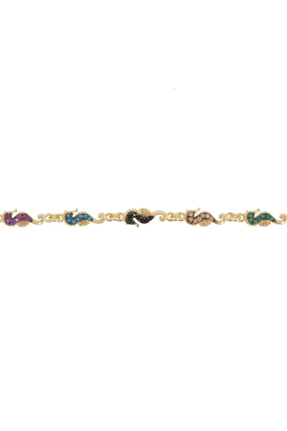 Gold seahorse charm bracelet close-up with tiny blue, purple, and black charms