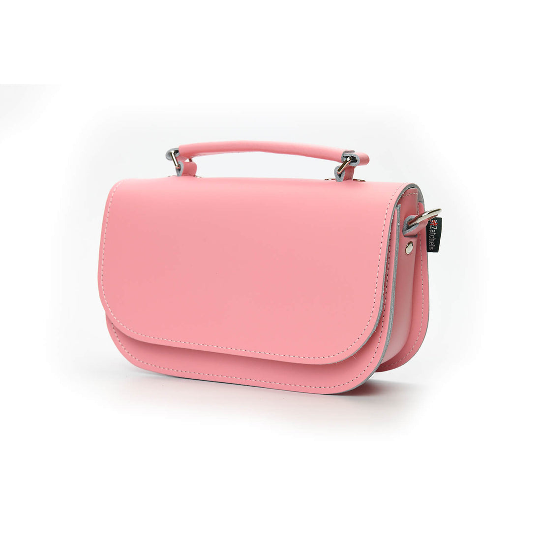 Pastel pink leather crossbody bag with curved flap and metal clasp