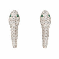 Pair of silver huggie snake hoop earrings with green enamel tops and pave stones