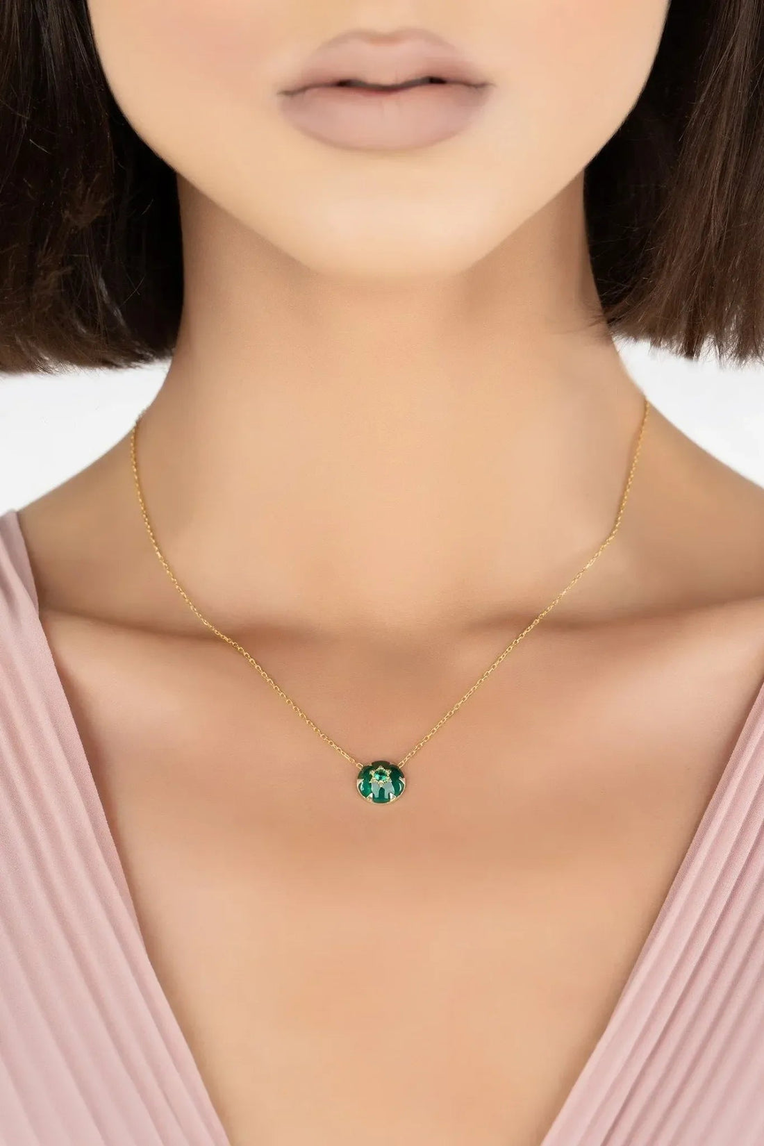 Gold-tone chain necklace with small green enamel Star of David pendant