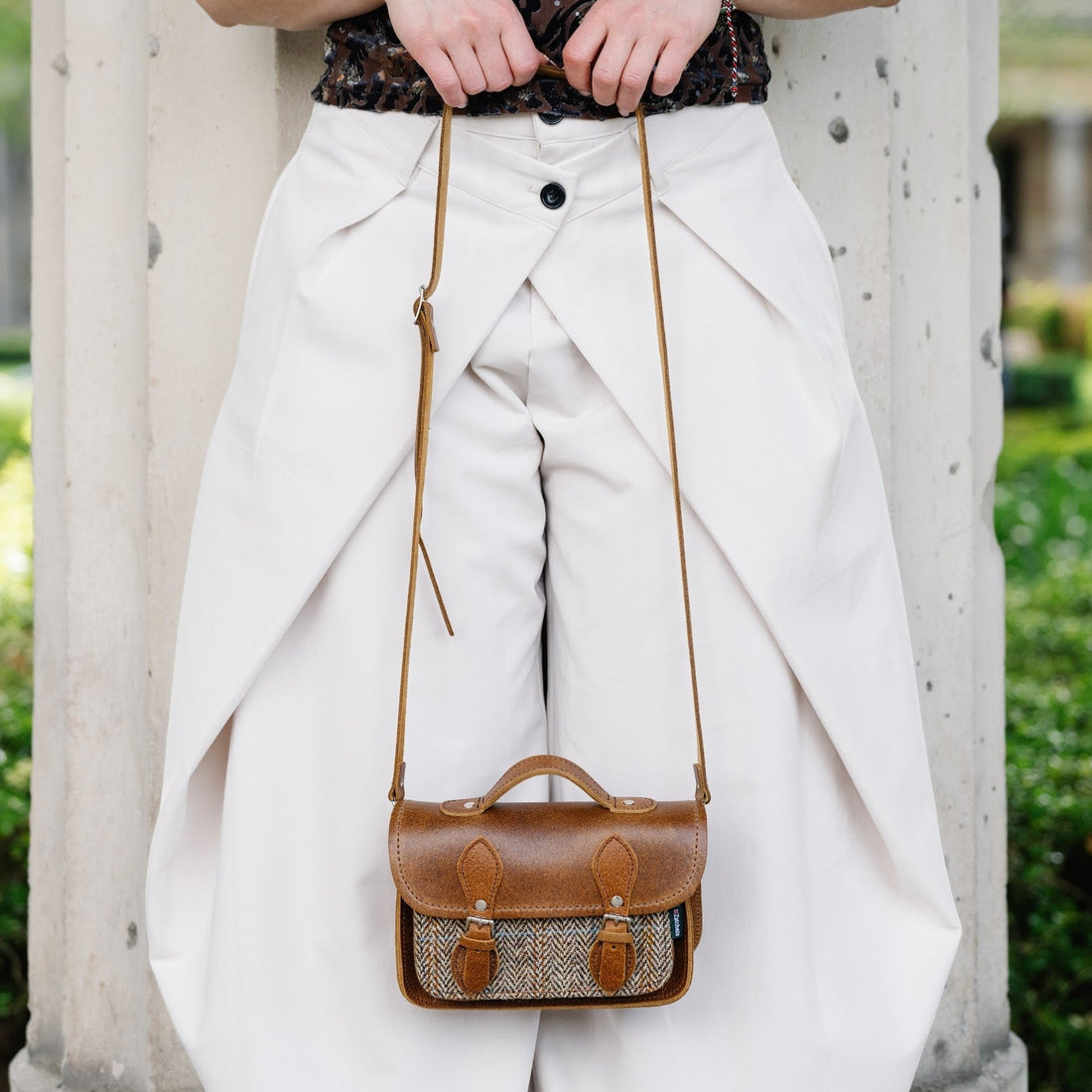 Tan leather and tweed micro crossbody satchel with front flap and adjustable strap