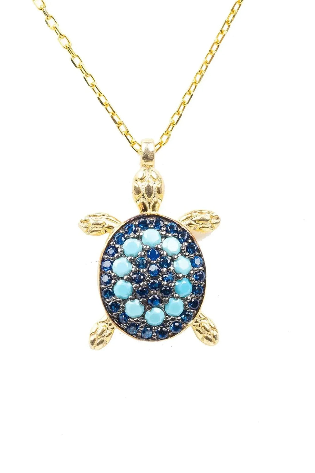 Gold-tone pendant necklace with blue turtle charm and turquoise bead accents