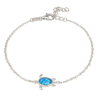Silver-tone turtle charm opalite bracelet with blue oval center stone