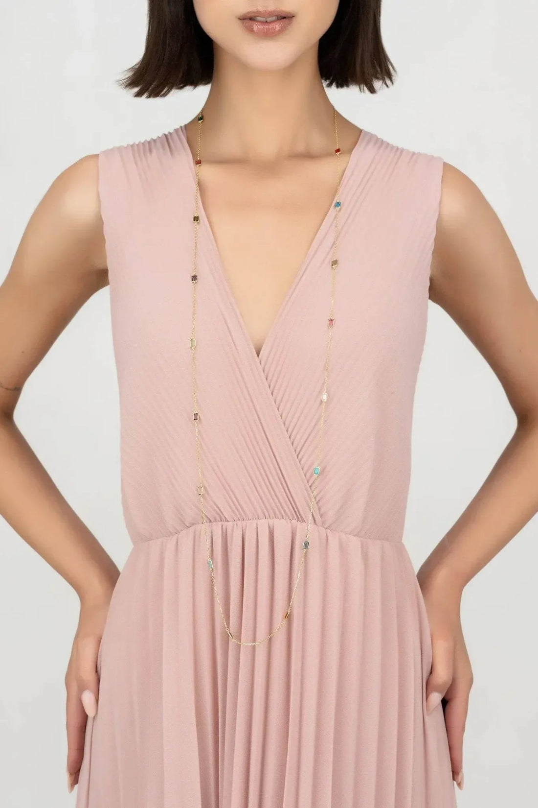 Gold layered necklace with tiny colored bead charms on delicate chains