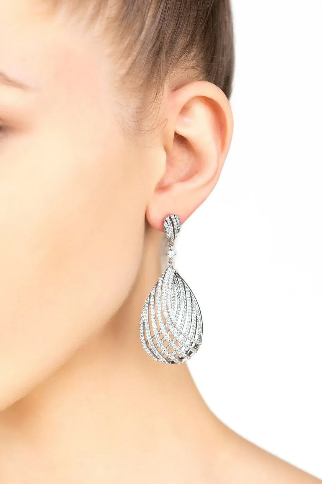 Silver teardrop earring with layered crystal drop design