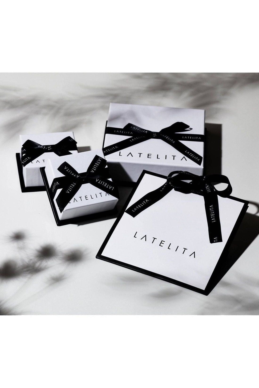Set of jewelry gift boxes with black ribbon and white cards
